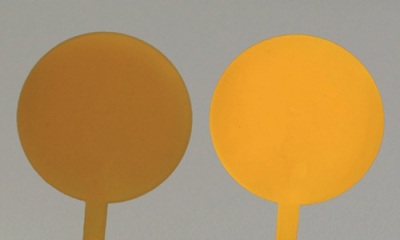 Polymeric compounds including CANdots® Series A Plus showing their processability (left: without excitation, right: with excitation