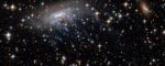 Intense Blue Streaks Stream Outwards from ESO 137-001 Spiral Galaxy