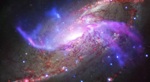 Giant Black Hole, Shock Waves, and Vast Reservoirs of Gas in Impressive Galactic Light Show
