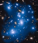 Hubble Picks up Ghostly Glow of Stars from Gravitationally Ripped Galaxies