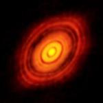 Forming Planets Could Be Responsible for Gaps in Dust and Gas Swirling Around HL Tau Star
