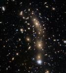 Gravitational Lensing Reveals Largest Sample of Faintest, Earliest Known Galaxies