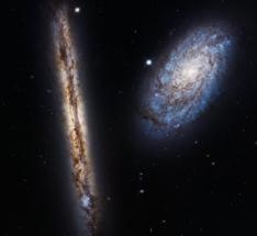 Hubble Captures Stunning Cosmic Pairing of Two Very Different Looking Spiral Galaxies